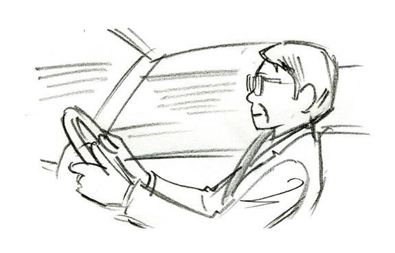 画像：運転する男性